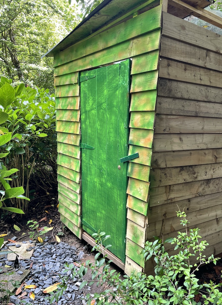 composting toilet hidden away in the garden